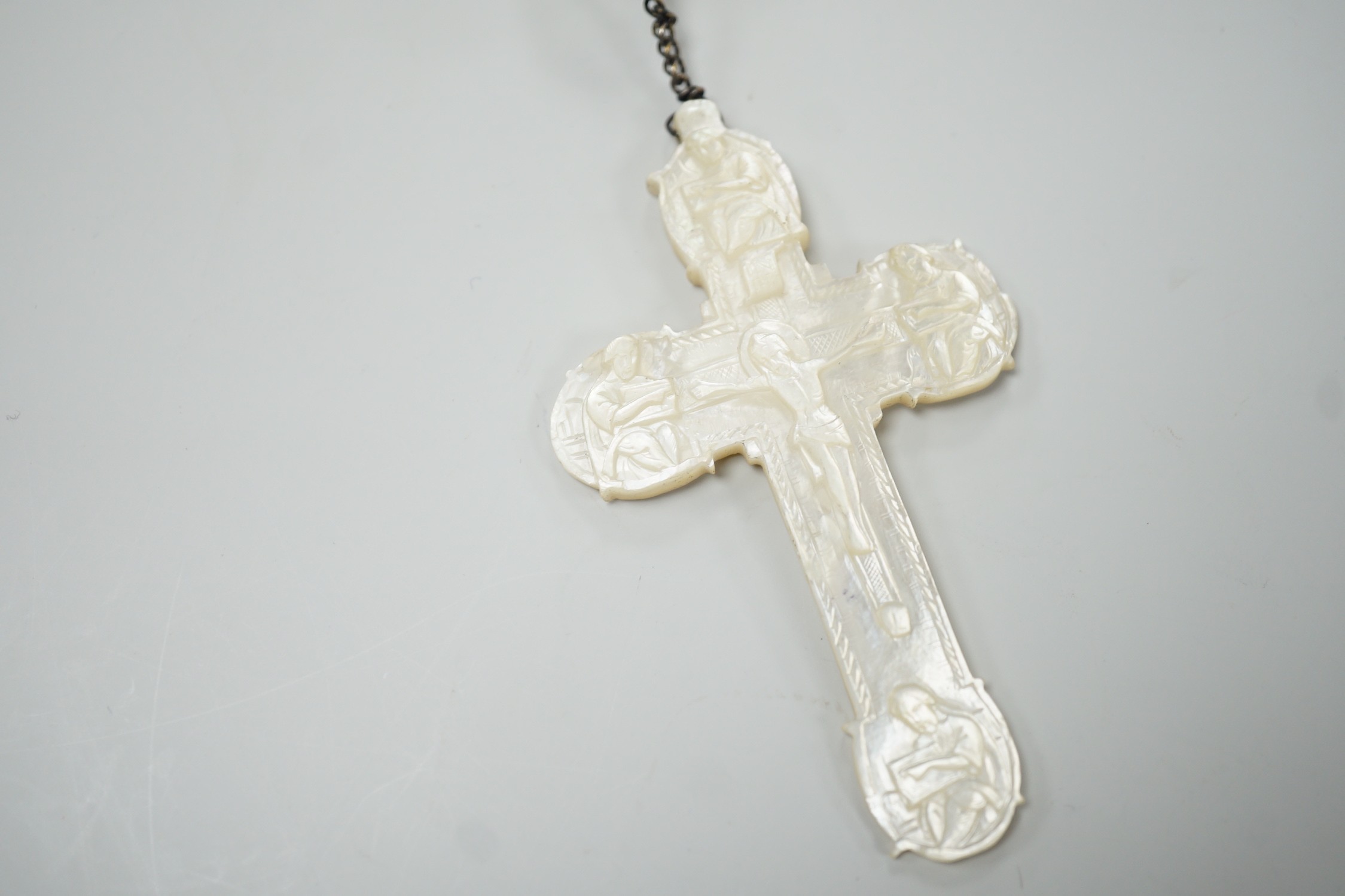 A long mother of pearl rosary, 158cm, with carved mother of pearl crucifix pendant, 8cm.